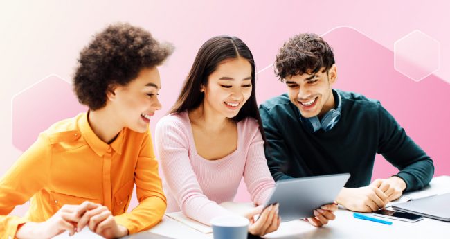 Image shows three students looking at a tablet