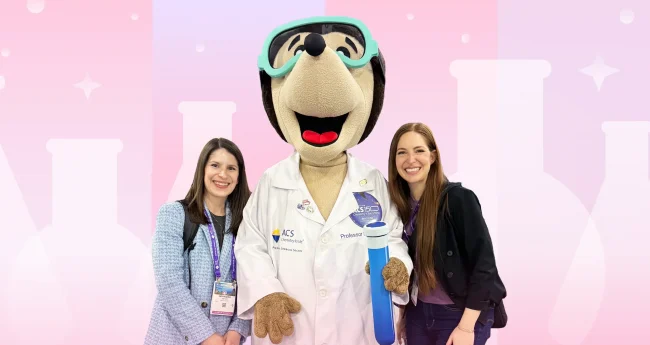 Two Aktiv team members pose with the ACS Mole mascot at the ACS Spring conference.